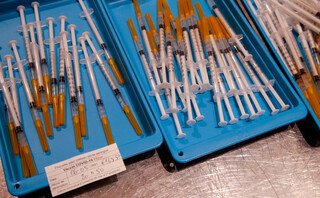 photo syringes with the Pfizer vaccine against COVID-19